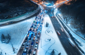 Drivers on Snowy Freeway